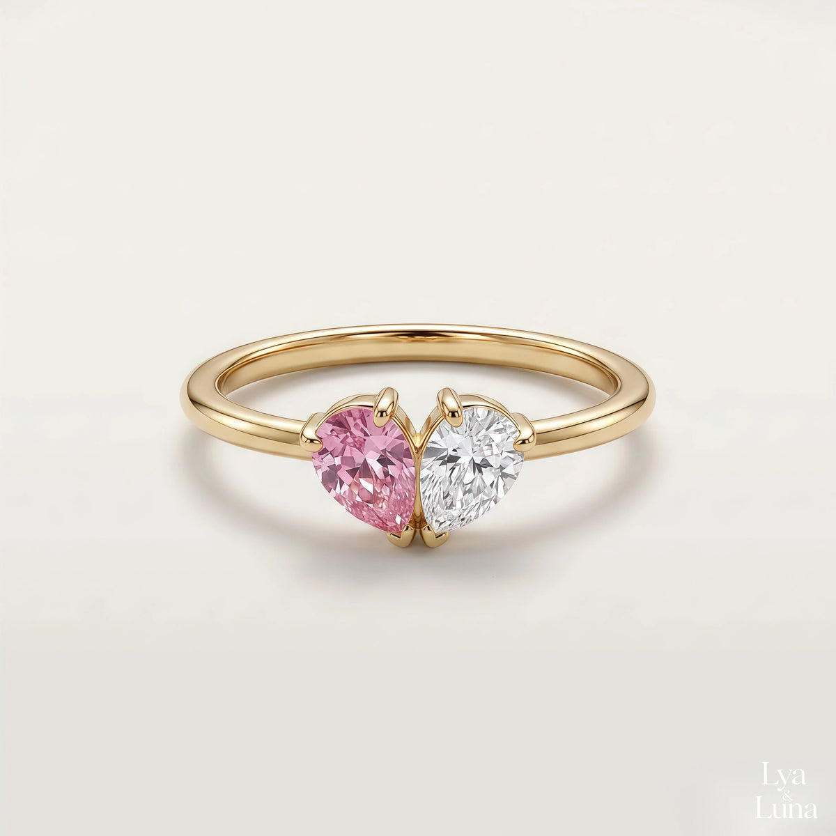 Bague Veria – pierres rose et blanche réunies en cœur, finition or